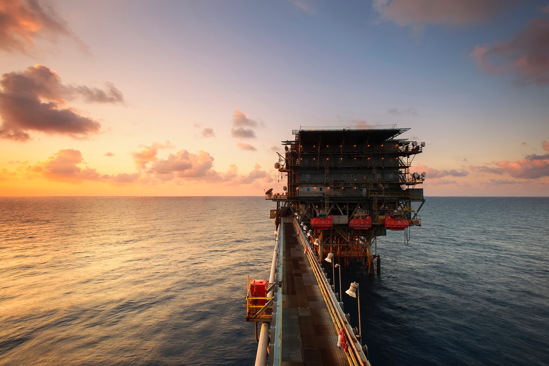 sunset over oil rig